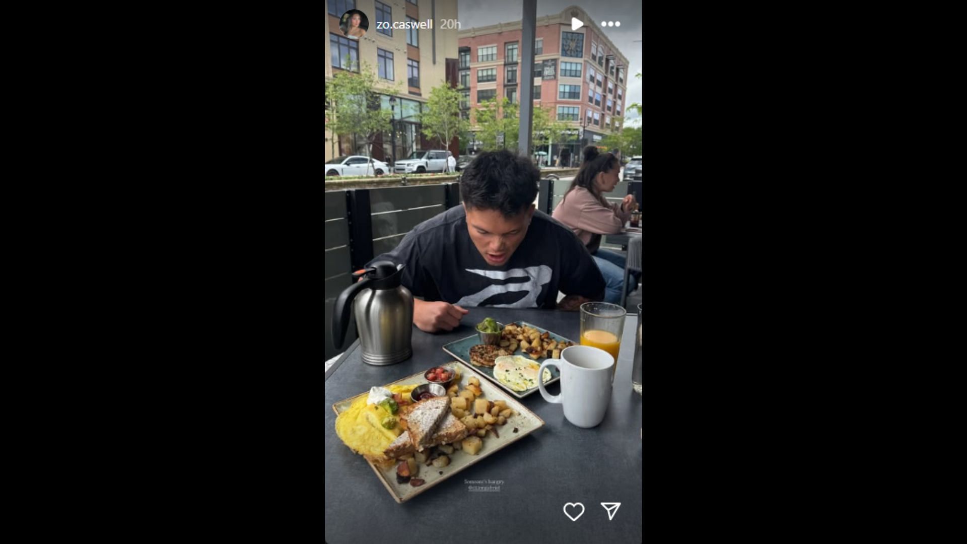 Zo Caswell's photo of Dillon Gabriel preparing for their meal. (Photo via Zo Caswell's Instagram Story)